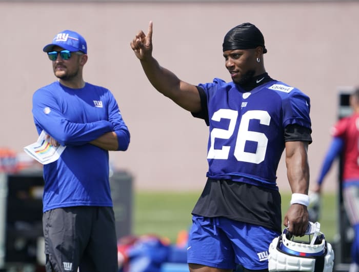 Jul 26, 2023; East Rutherford, NJ, USA; New York Giants running back Saquon Barkley (26) and quarterbacks coach Shea Tierney, left, at the Quest Diagnostics Training Facility.